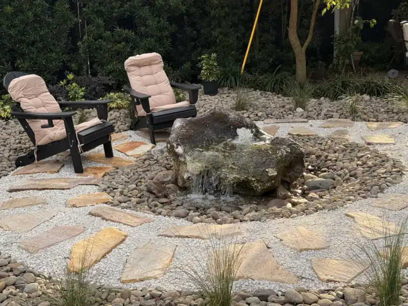 Stone patio and water feature installed by DeAngelo’s Land Services