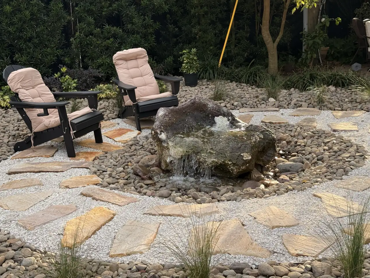 Stone patio and water feature installed by DeAngelo’s Land Services