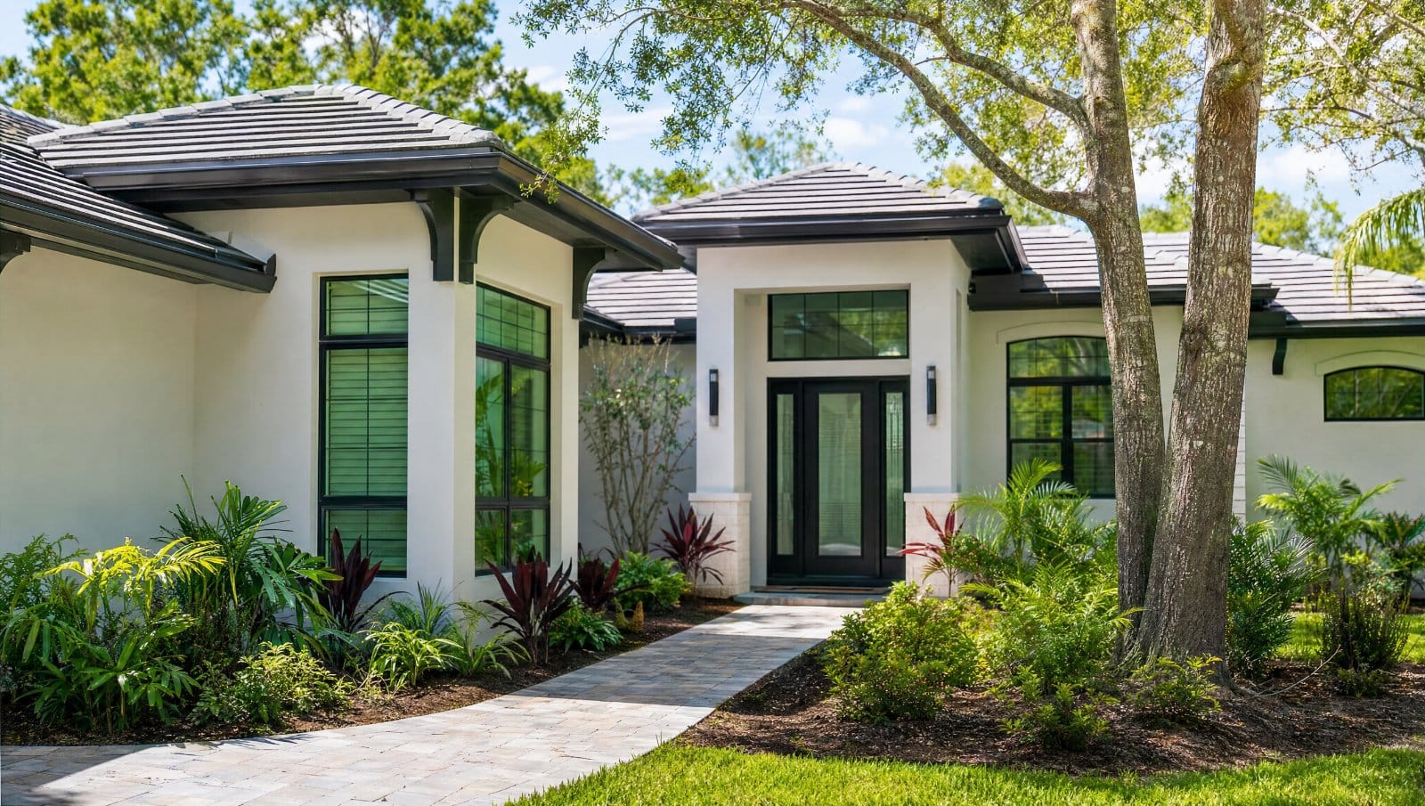 Modern Central Florida residential landscape with clean lines, native plants and a paver path