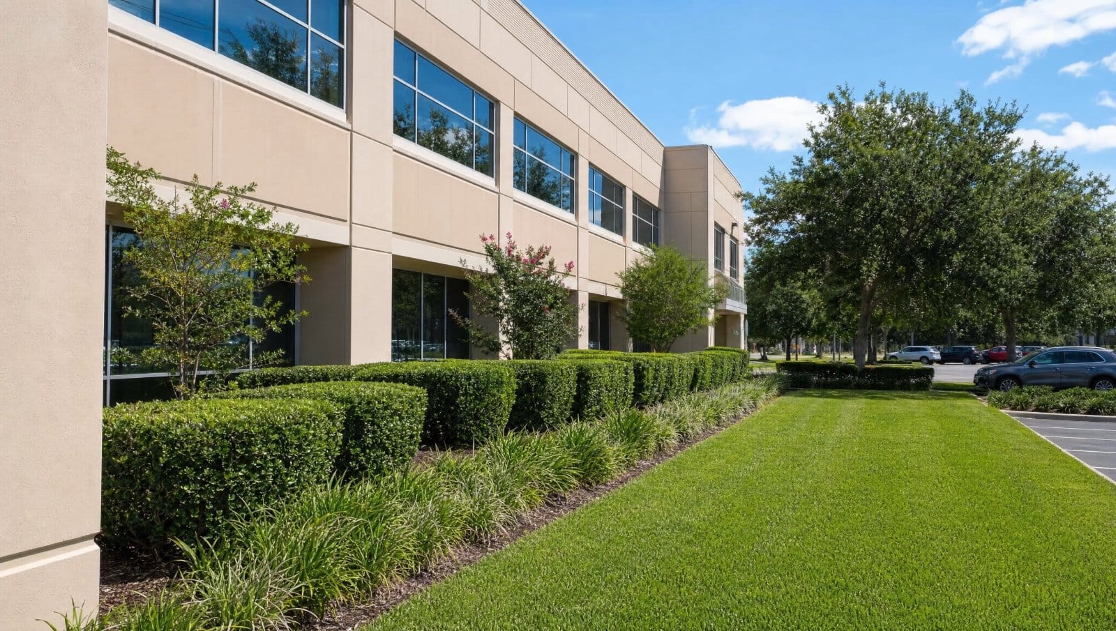 Professionally maintained commercial property landscape with trimmed hedges and lawn in Central Florida